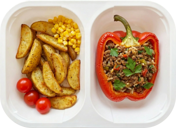 Meat and rice stuffed capsicum with roasted potato and vegetables